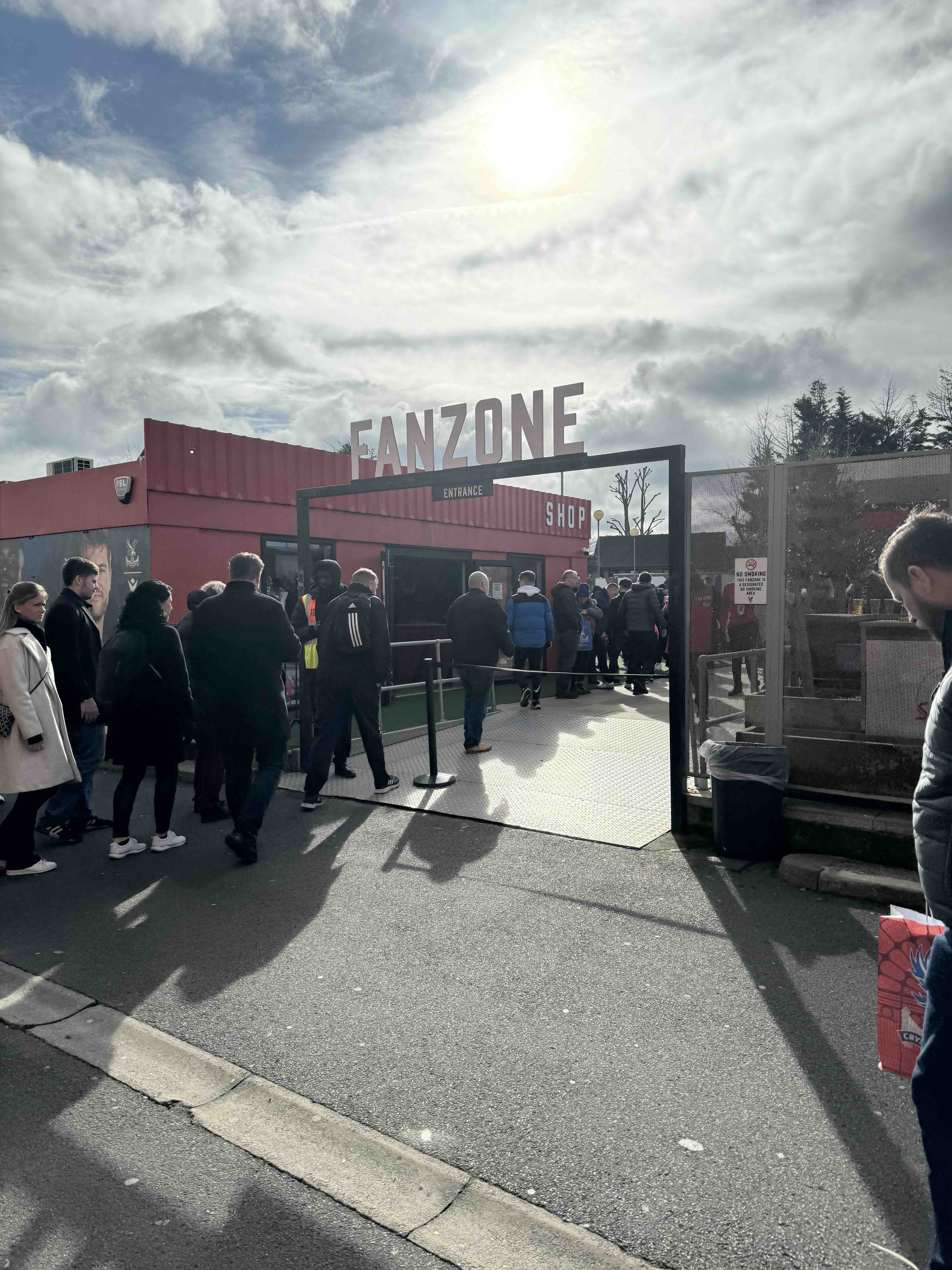 Fans entering the Crystal Palace fanzone outside Selhurst Park before kick off.
