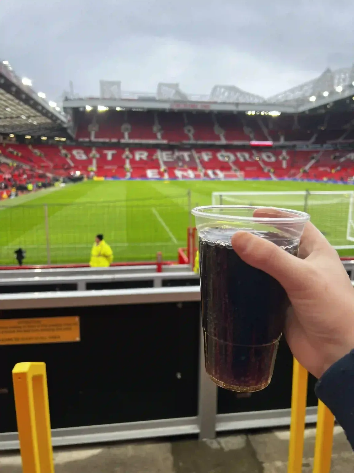Enjoying a cup of soda on Old Trafford